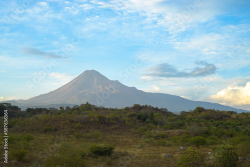 Colima Volcano; Mexican landscape with blue sky and clouds.