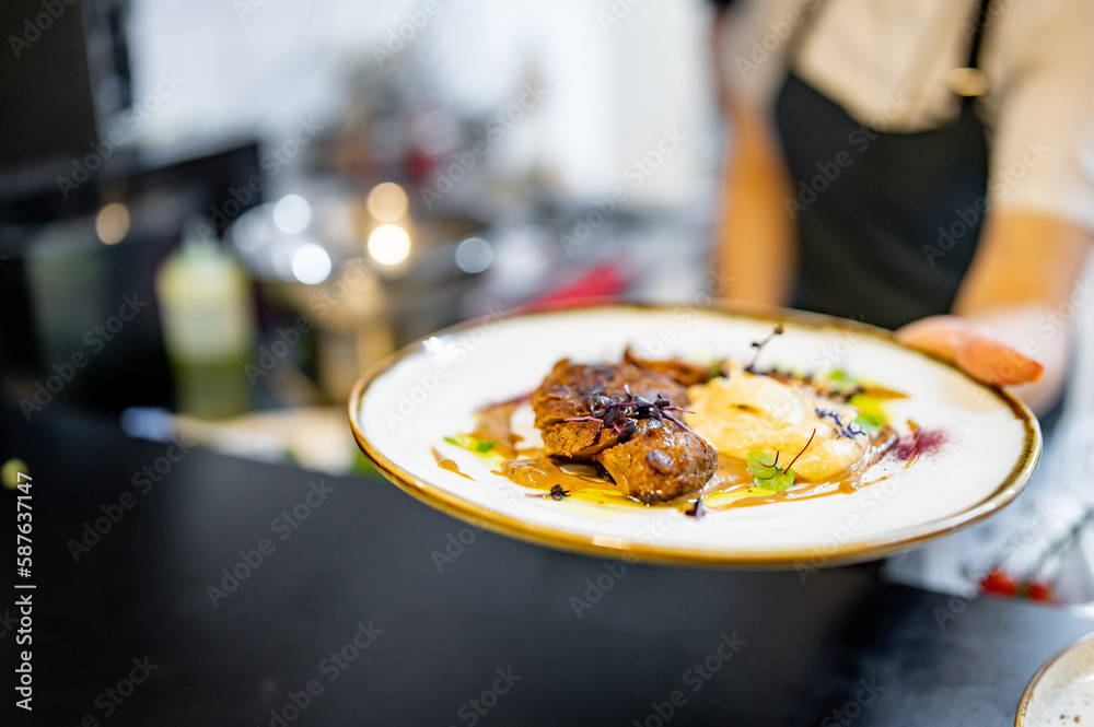 Chef cooking Roasted Duck breast fillets with mashed potato on