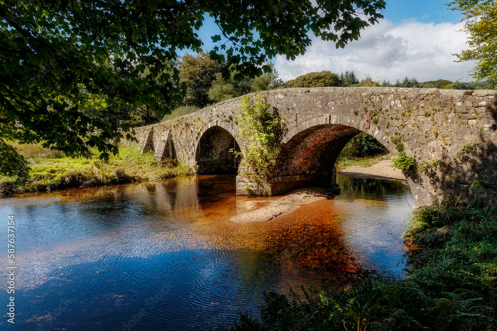 Fototapeta premium Old stone bridge, Two Bridges, Dartmoor, Devon, England