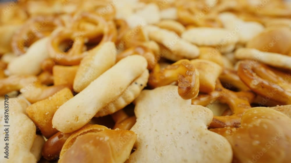 Pretzels close up view. Salty snacks with poppy seeds and salt Pretzels close up view. Salty snacks with poppy seeds and salt