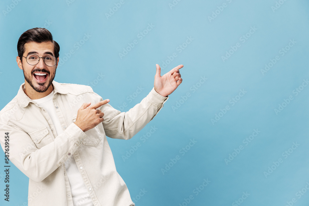 Portrait of a stylish man smile with teeth and happiness in glasses for farsightedness and myopia, on a blue background in a white T-shirt, space space Portrait of a stylish man smile with teeth and happiness in glasses for farsightedness and myopia, on a blue background in a white T-shirt, space space
