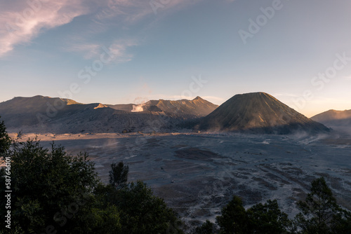 Amazing desert volcanic landscape of Bromo Volcano and Batok Volcano during sunset, Java, Indonesia