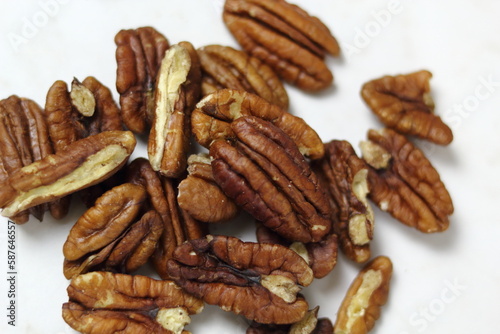 Pecan Nut Halves. Isolated on white background. Directly Above.