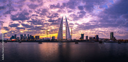 city skyline at sunrise with beautiful clouds in background photo