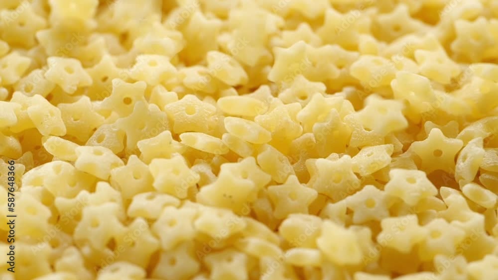 Uncooked Italian Stelline pasta, macro shot close up. Uncooked Italian Stelline pasta, macro shot close up.