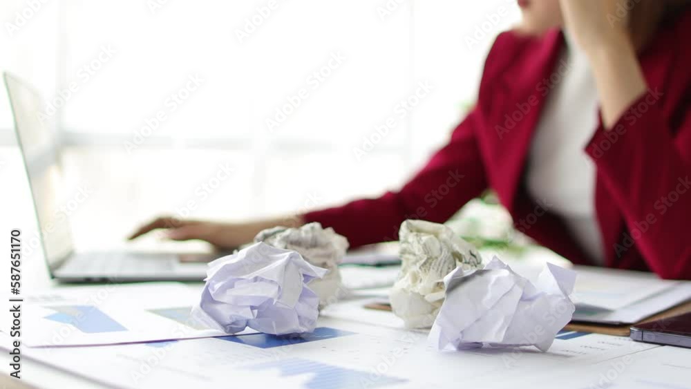 Businesswoman in the office who is serious about work, stressed and worried about not completing tasks on deadlines. Businesswoman in the office who is serious about work, stressed and worried about not completing tasks on deadlines.