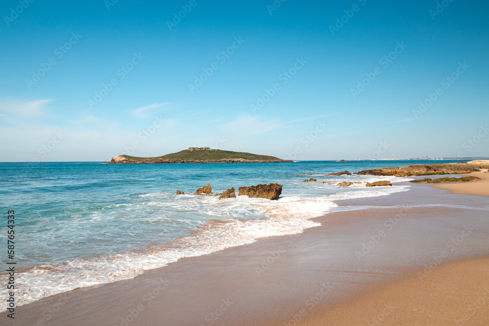 Walk along the Atlantic Ocean on the beach called Praia da Ilha do Pessegueiro near Porto Covo, western Portugal. Steps over Rota Vicentina Walk along the Atlantic Ocean on the beach called Praia da Ilha do Pessegueiro near Porto Covo, western Portugal. Steps over Rota Vicentina