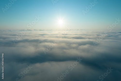 Aerial view at sunrise time over cloud foggy