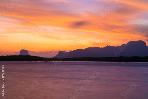 red sky sunset and river or lake