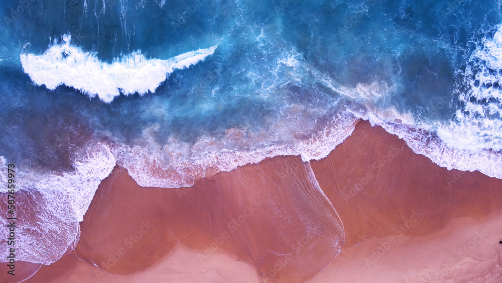 Top-view beach sea wave texture on sand beach