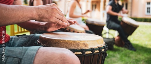 Konstfotografi Engaging scene of learning to play the Djembe drums, with focused attention on rhythm and beats