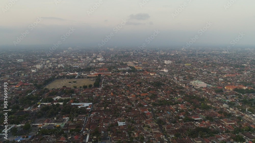 Obraz premium aerial view yogyakarta city cultural capital indonesia located on java island. Yogyakarta with buildings, highway at sunset time. aerial view