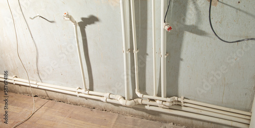 Connecting plastic pipe. Installing water heating radiator