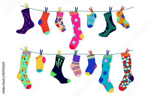 Socks on a rope with colored clothespins. Dry the sock and hang it on a clothesline with clothespins. Children's socks, for men and women. Flat design style. Vector illustration
