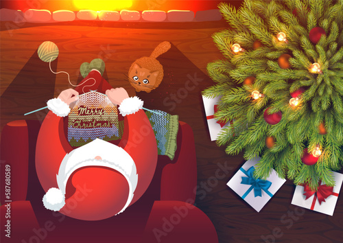 Cartoon Santa Claus knits a scarf with the inscription Merry Christmas at the fireplace with cute kitten and christmas tree. View from above.