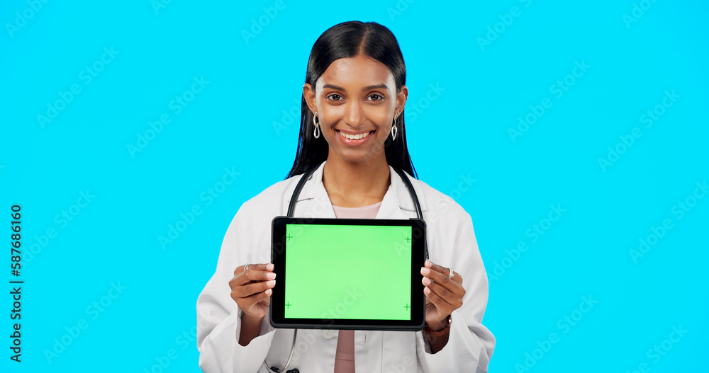Tablet, green screen and doctor face isolated on blue background telehealth, medical or service software app. Healthcare professional or indian person on digital technology, studio and mockup space Tablet, green screen and doctor face isolated on blue background telehealth, medical or service software app. Healthcare professional or indian person on digital technology, studio and mockup space