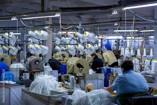 production of capron tights. Textile factory with machines and equipment for production of women's stockings and capron tights.