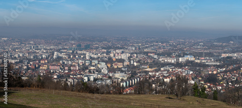 Panoramic view of Banja Luka city, distant hills fade in haze, air pollution in city