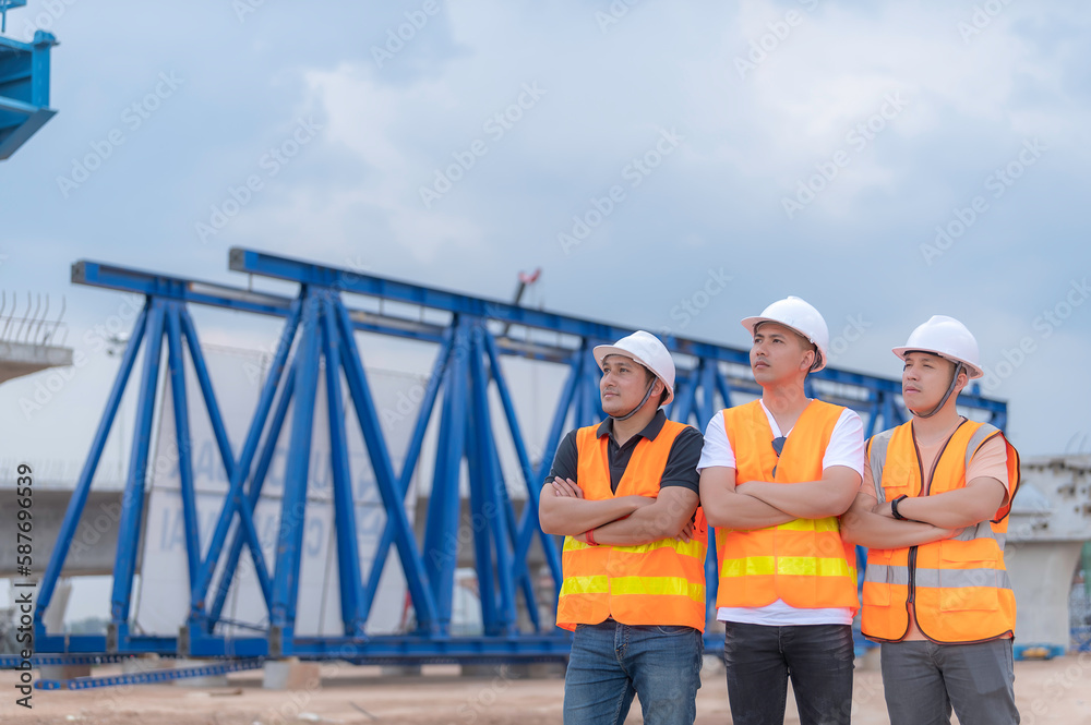 Group of asian engineers discuss about work at site of building under construction,The contractor team discusses the design of the structure,Three workers are working outside. Group of asian engineers discuss about work at site of building under construction,The contractor team discusses the design of the structure,Three workers are working outside.