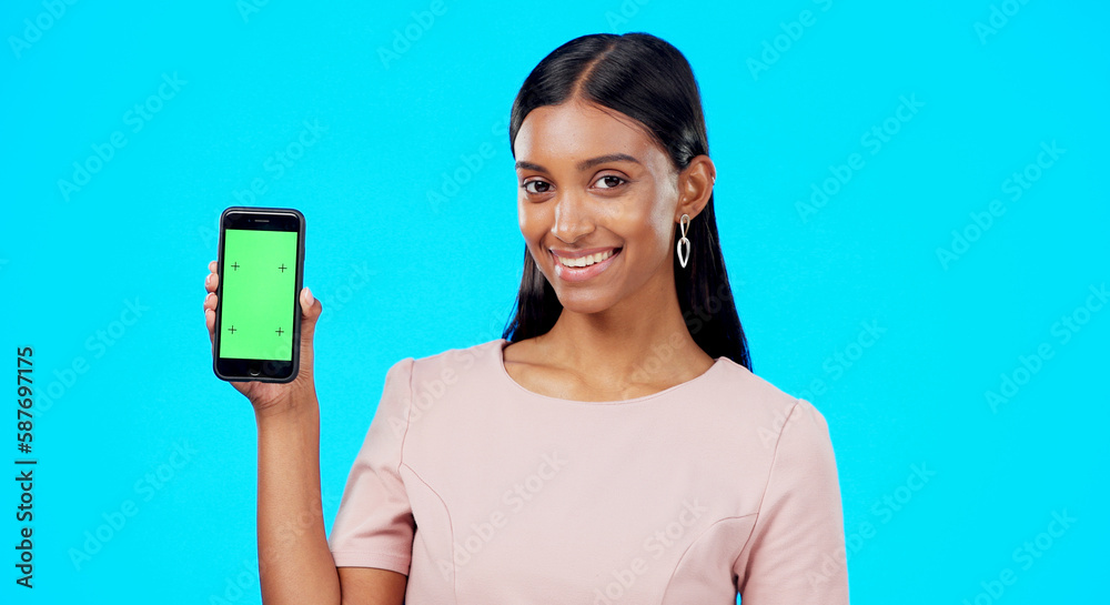 Chroma key, green screen and woman holding phone with mockup for logo, branding and mobile app advertising. Smile, happy and portrait of professional female isolated in a studio blue background Chroma key, green screen and woman holding phone with mockup for logo, branding and mobile app advertising. Smile, happy and portrait of professional female isolated in a studio blue background