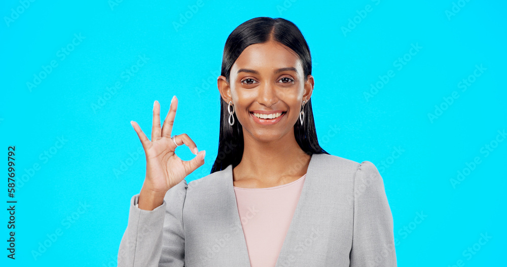 Perfect, satisfied and businesswoman with ok hand gesture, sign or symbol feeling happy isolated in studio blue background. Smile, excited and portrait of satisfied female showing yes and approval Perfect, satisfied and businesswoman with ok hand gesture, sign or symbol feeling happy isolated in studio blue background. Smile, excited and portrait of satisfied female showing yes and approval