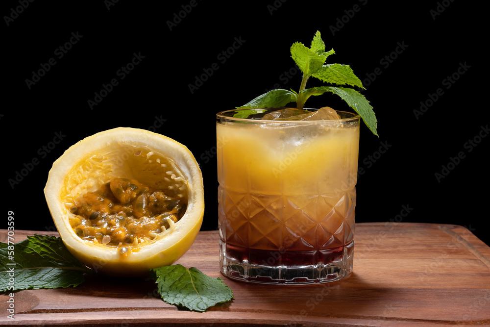 a glass of passion fruit cocktail and red wine, a reinterpretation of the Sex on the Baech cocktail a glass of passion fruit cocktail and red wine, a reinterpretation of the Sex on the Baech cocktail