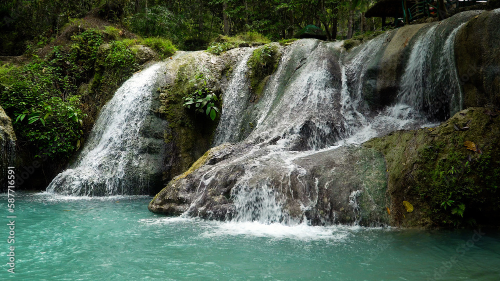 Waterfall in the jungle on the island of Mindanao, Philippines. Waterfall in the rainforest.