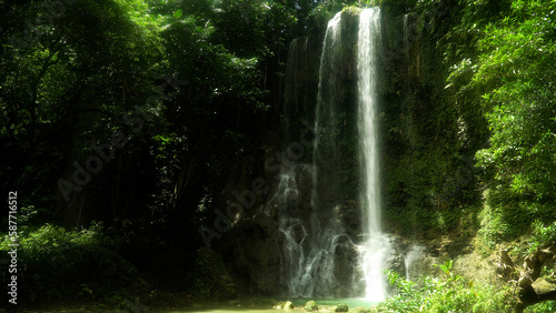 Kawasan Falls in green forest. Waterfall in the tropical mountain jungle. Bohol  Philippines.