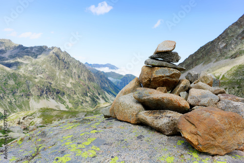 small cairn indicating the hiking trail in the Pyrenees. Small pile of pebbles indicating a milestone on a path in the mountains
