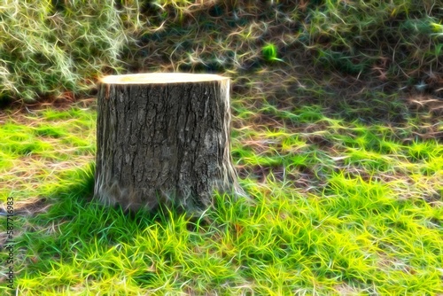 tree stump with a neon-style on the meadow