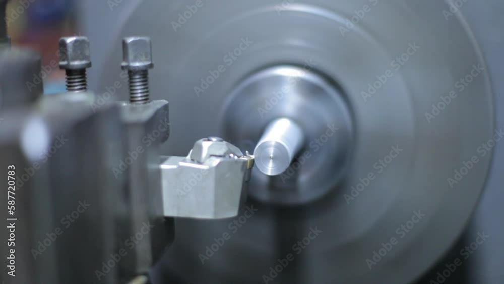 Close shot of a lathe machine in a factory Close shot of a lathe machine in a factory