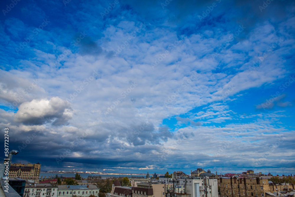 dramatic blue cloud over the city.