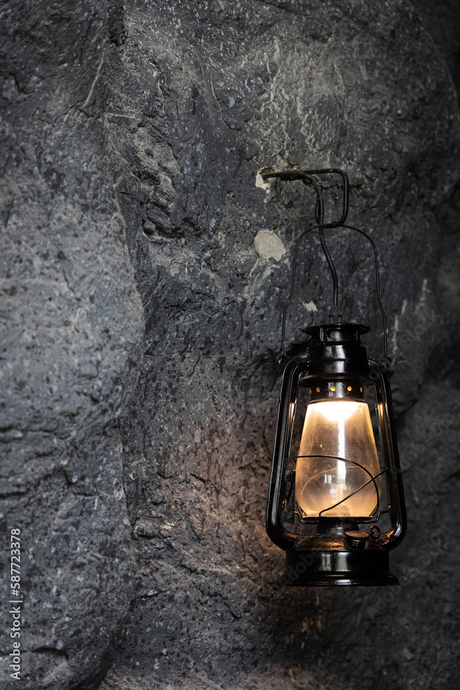 lamp warm light retro antique old vintage on stone wall