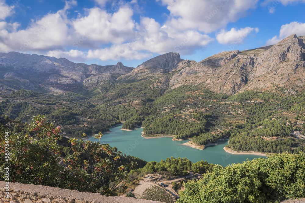 Panoramic view of the Guadalest reservoir in Alicante with turquoise water. Spain.