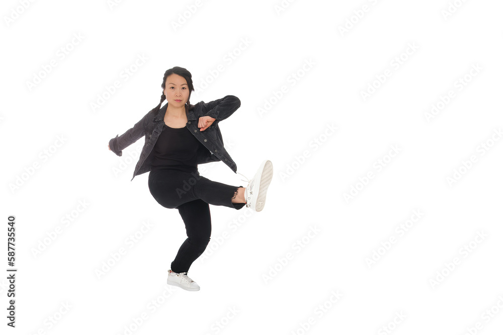 Asian young woman doing martial arts in everyday casual street clothing Asian young woman doing martial arts in everyday casual street clothing