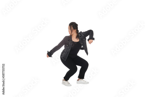 Asian young woman doing martial arts in everyday casual street clothing