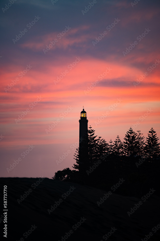 Stunning view of the Maspalomas lighthouse during a beautiful sunset. Gran Canaria, Canary Islands.