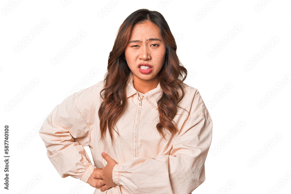 A young chinese woman having a liver pain, stomach ache. A young chinese woman having a liver pain, stomach ache.