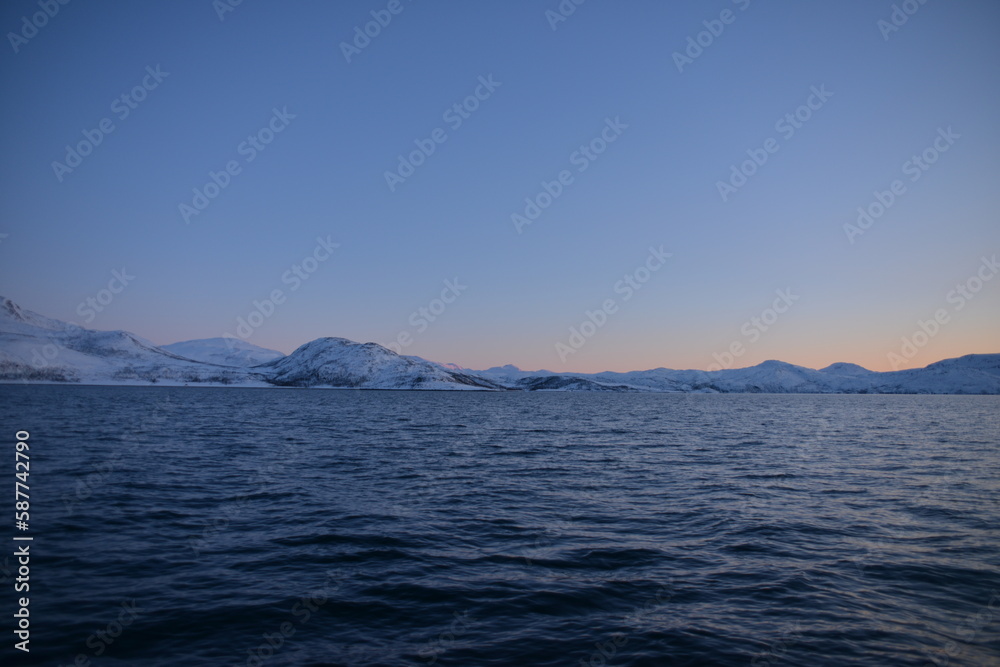 Mountains in the northern part of Norway, at the outlet to the ocean. Incredible sunset Mountains in the northern part of Norway, at the outlet to the ocean. Incredible sunset