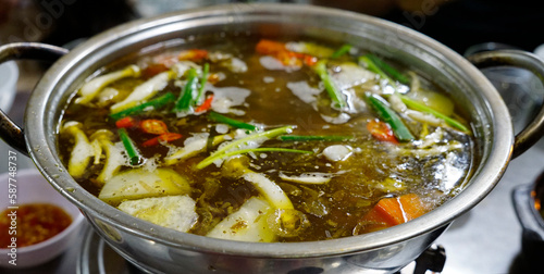 Delicious hot pot broth with mixed vegetables 
