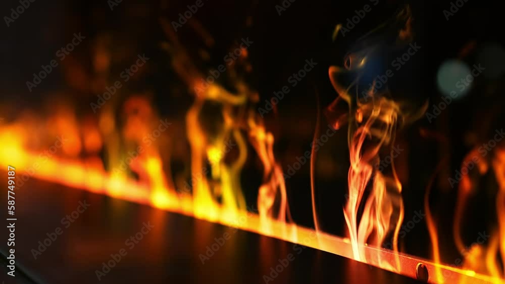 Fire line and fireplace in super slow motion on black, shooting with high speed cinema camera in 4K. Beautiful fireplace interior design. Fire line and fireplace in super slow motion on black, shooting with high speed cinema camera in 4K. Beautiful fireplace interior design.
