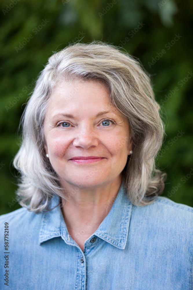 Close up outdoor portrait of attractive senior woman. Close up outdoor portrait of attractive senior woman.