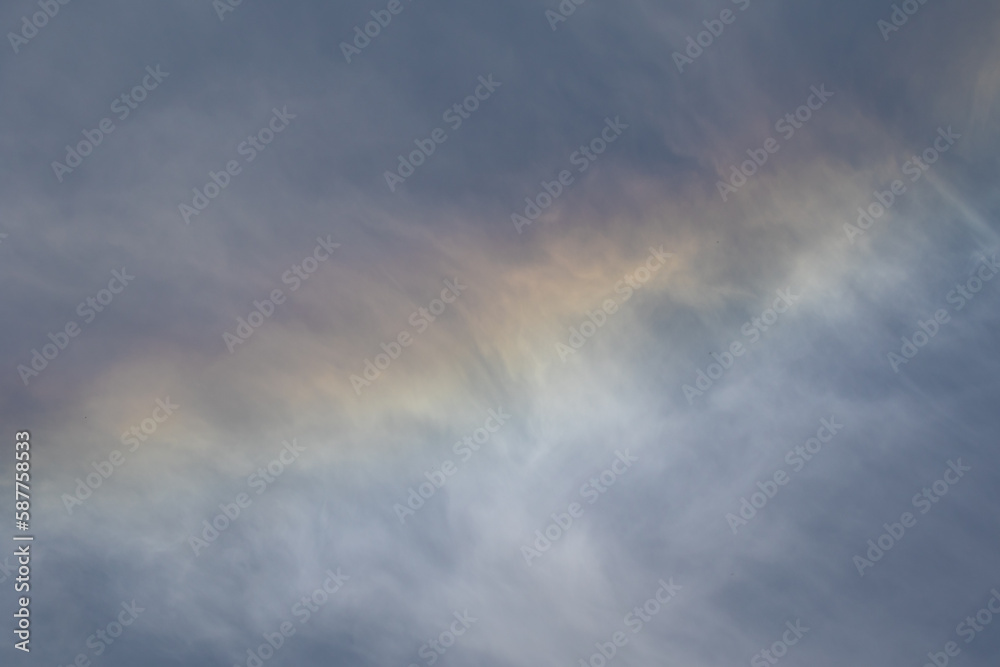 Rainbow on the cloudy sky
