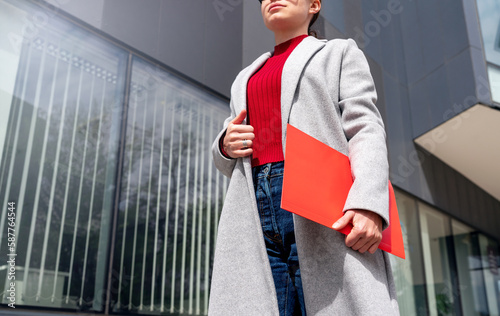 Confident female entrepreneur going to the office. photo