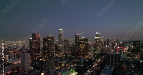 Wallpaper Mural Los Angeles skyline aerial drone night downtown. Aerial shot of downtown Los Angeles skyscrapers at night. City lights and building towers from a drone with urban streets and traffic. Torontodigital.ca