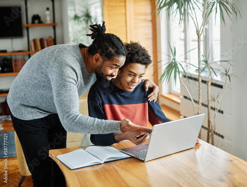 father child home family homework son  teenage parent education laptop teen boy teaching childhood man  learning together school computer internet teacher tutor black photo