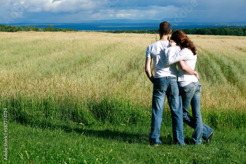 Young Couple Overlooking Farmland Hugging  Ile D Orleans  Quebec.