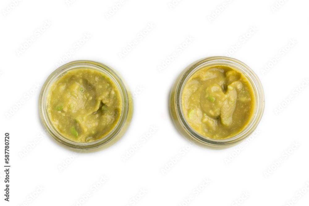 Baby puree with vegetable mix, broccoli, avocado in glass jar isolated on white, top view Baby puree with vegetable mix, broccoli, avocado in glass jar isolated on white, top view