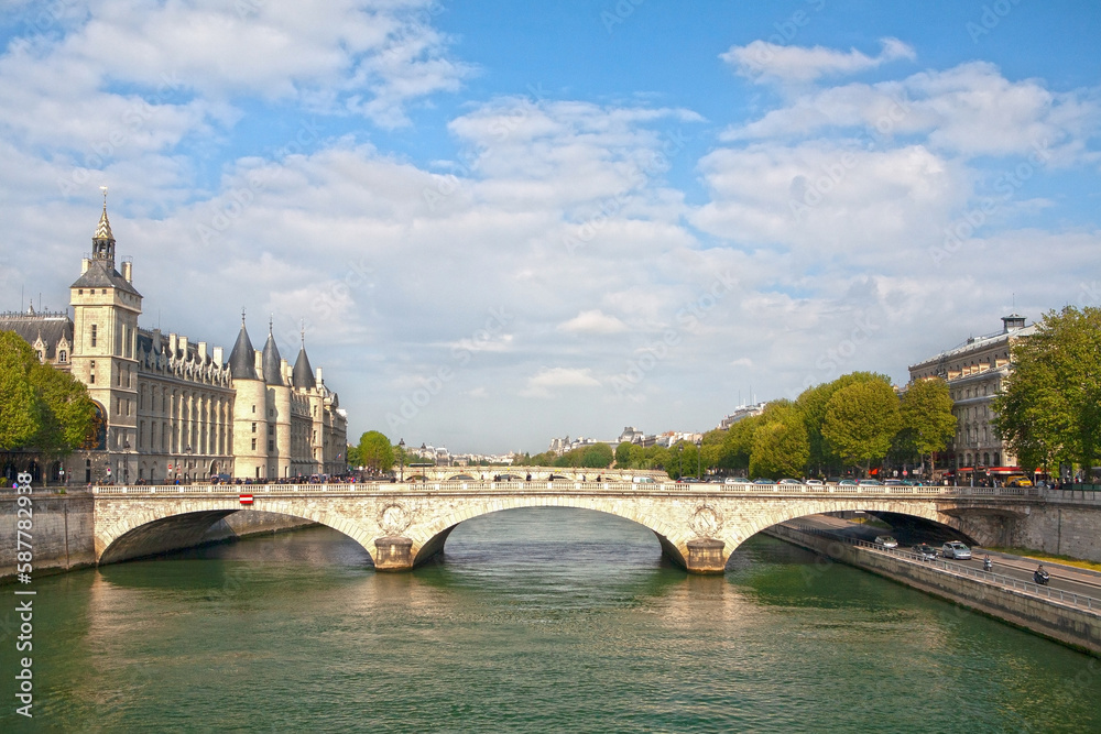 Obraz premium Panorama of Paris (France) with the Pont au Change over the Seine River and the former Royal Castle and the Conciergerie Prison (La Conciergerie) on the left bank.