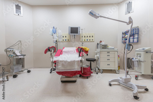 Gynecology in the clinic gynecology room, interior of the genicology clinic. Maternity chair in the surgical obstetric ward. Chair for inspection of pregnant women. Inspection room in the hospital. photo